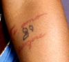 christina aguilera arm tattoos